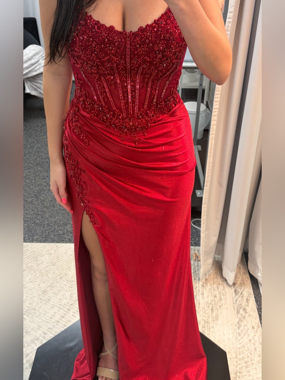 Red beaded strapless corset prom dress